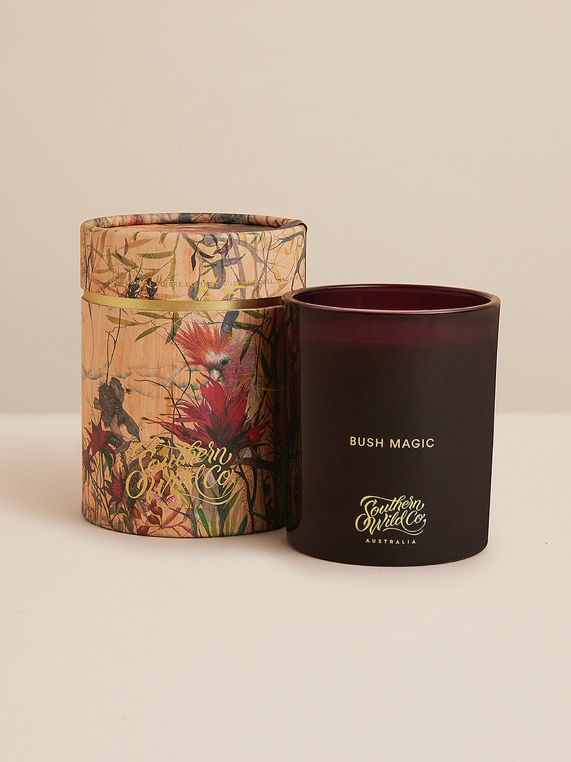 Studio shot of the Bush Magic candle with illustrated cylinder packaging, celebrating native flora and poetic storytelling in scent.