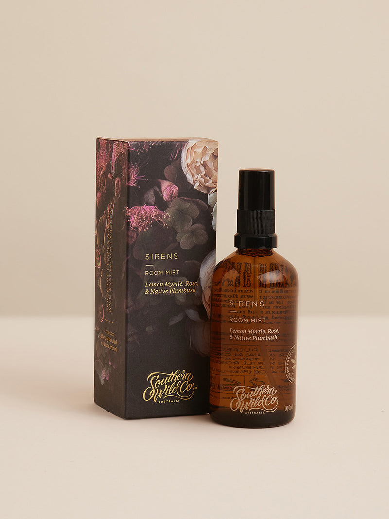Sirens Room Mist and packaging captured in natural light, showcasing its floral, botanical blend of Lemon Myrtle, Rose and Native Plumbush.
