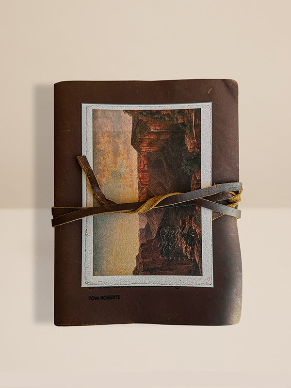 Brown leather Southern Wild Co Sketch book with a scenic cover on a beige background