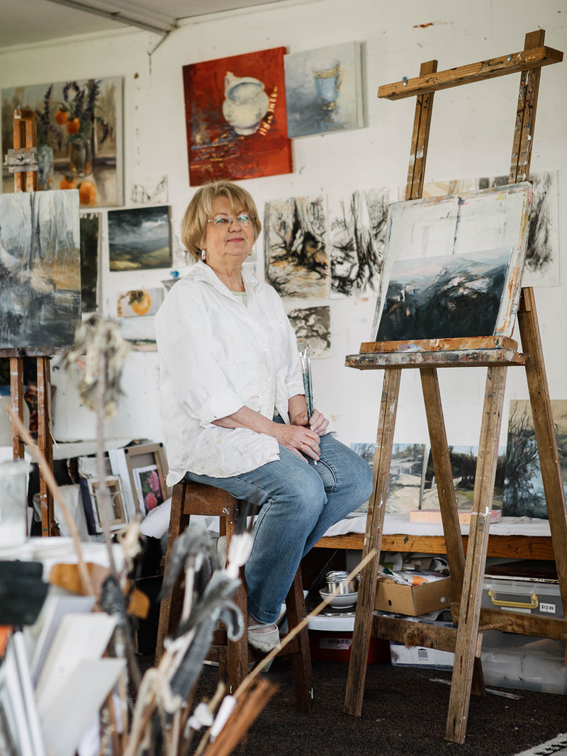 Blue Mountains-based Australian artist Natasha Daniloff in her studio surrounded by expressive landscape and still life paintings – Southern Wild Co artist collaborator captured in her creative space.