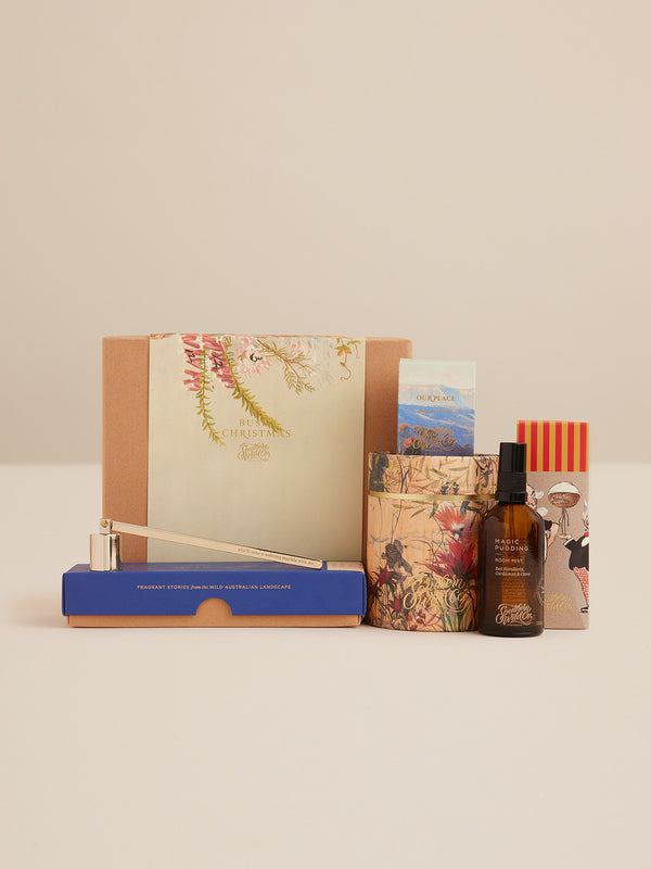 Bush Christmas gift set by Southern Wild Co including Magic Pudding room mist, Our Place votive, limited edition candle, and candle snuffer in festive native flora packaging.