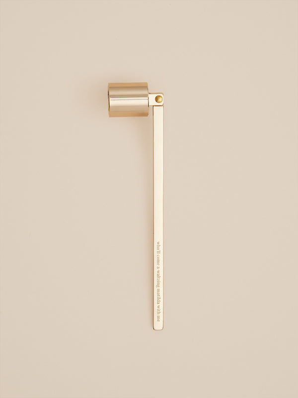 Elegant gold candle snuffer engraved with “who’ll come a waltzing matilda with me” — a poetic tool for ending the flame with grace.