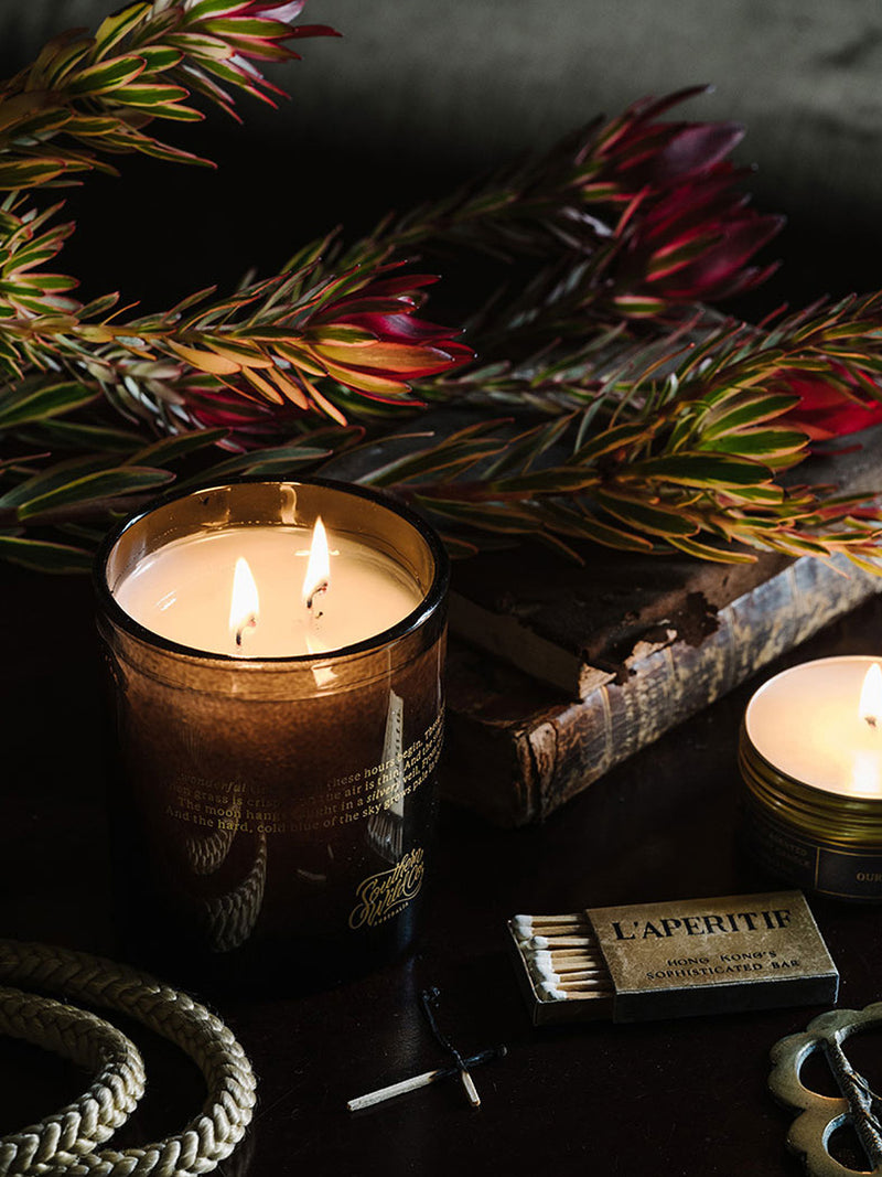 Southern Sky candle styled with native flowers, vintage objects and old books—an Australian-made candle inspired by the night sky and timeless interiors.