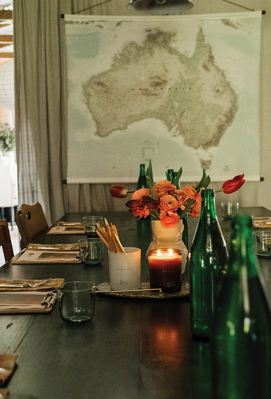 Winter workshop table set in the Southern Wild Co Atelier with candlelight and flowers.